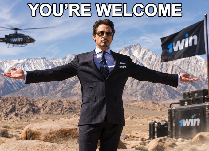 A meme image featuring Robert Downey Jr. in a pinstripe suit with arms outstretched in a welcoming gesture, set against a mountainous desert backdrop with '1win' branded flags, a helicopter, and cases, captioned 'YOU'RE WELCOME'.
