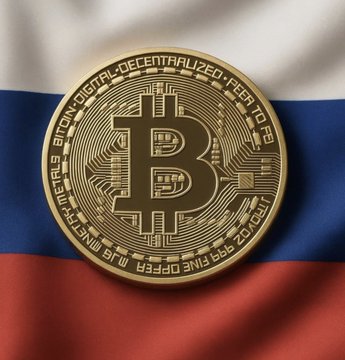 A physical Bitcoin token rests against a Russian flag, illustrating the post's claim that Russia has officially legalized Bitcoin and crypto for international trade, with the coin's inscriptions "BITCOIN DIGITAL DECENTRALIZED PEER TO PEER" and "999 FINE COPPER" reinforcing the message of official cryptocurrency adoption by a global superpower.