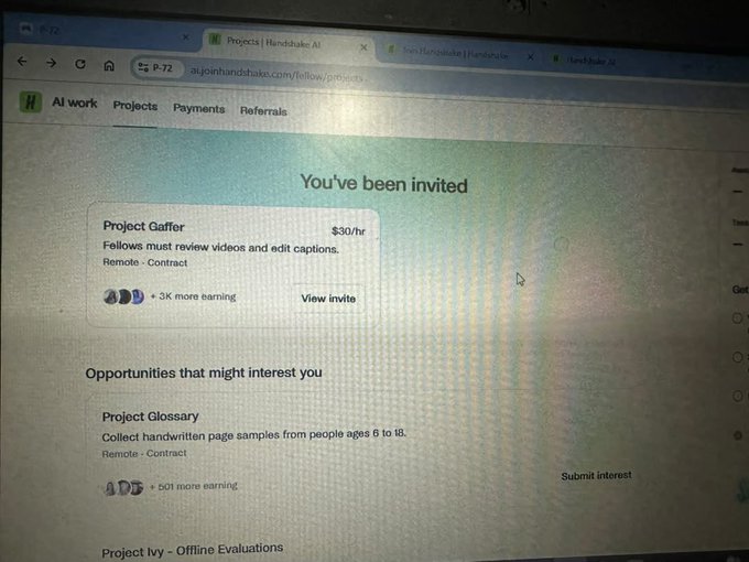 A photograph of a computer screen showing the Handshake AI website, displaying a "You've been invited" notification for "Project Gaffer" offering $30/hr to review videos and edit captions remotely, along with other opportunities like Project Glossary.