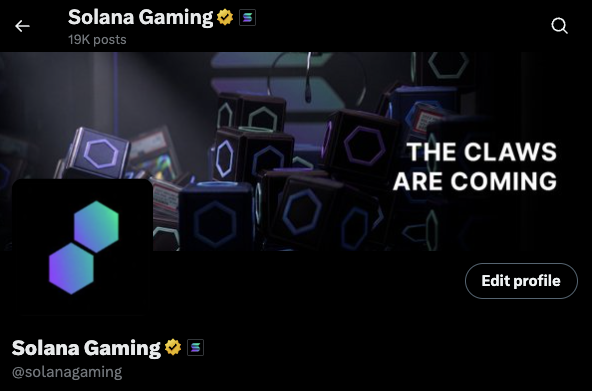 The image shows a Twitter/X profile for "Solana Gaming" (@solanagaming) with 19K posts, featuring a dark banner with claw machine imagery and the text "THE CLAWS ARE COMING," suggesting the account is officially tied to the Solana gaming community or organization.