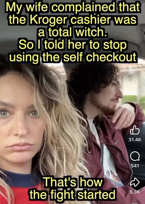 A selfie-style image of a woman in the foreground with a man looking out a car window in the background, overlaid with text reading: "My wife complained that the Kroger cashier was a total witch. So I told her to stop using the self checkout — That's how the fight started," with social media engagement metrics showing 31.4K likes, 541 comments, and 5.3K shares.