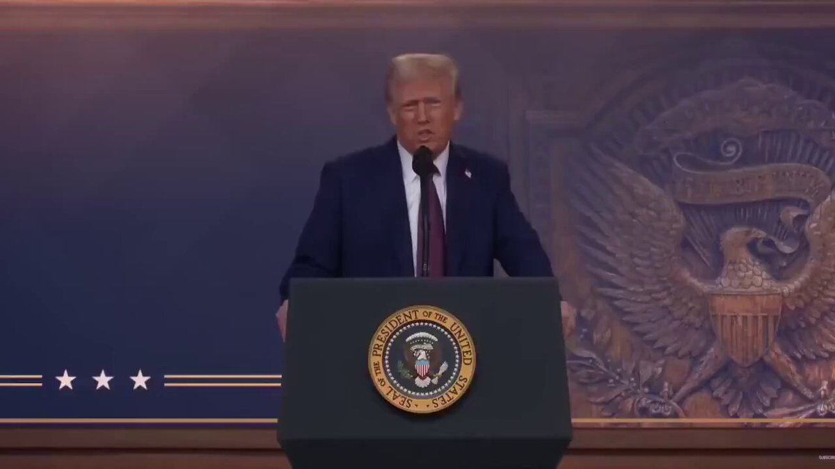 The image features a man standing at a podium with his hands on a microphone, giving him a commanding presence as he speaks into it. The backdrop of the scene includes a large American flag, which adds to the patriotic atmosphere. The text "CLARITY WEEK IS HERE Patrick Witt says a BIG week is ahead for crypto regulation clarity" suggests that there might be an upcoming event or announcement related to cryptocurrency regulations and clarity in this week's context.