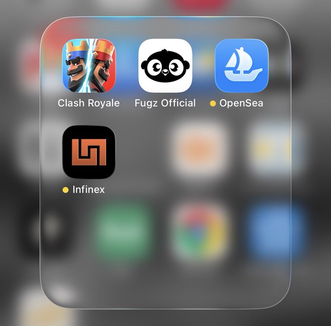 A screenshot of a smartphone home screen featuring app folders for gaming and crypto, including 'Clash Royale', 'Fugz Official', 'OpenSea', and 'Infinex'.