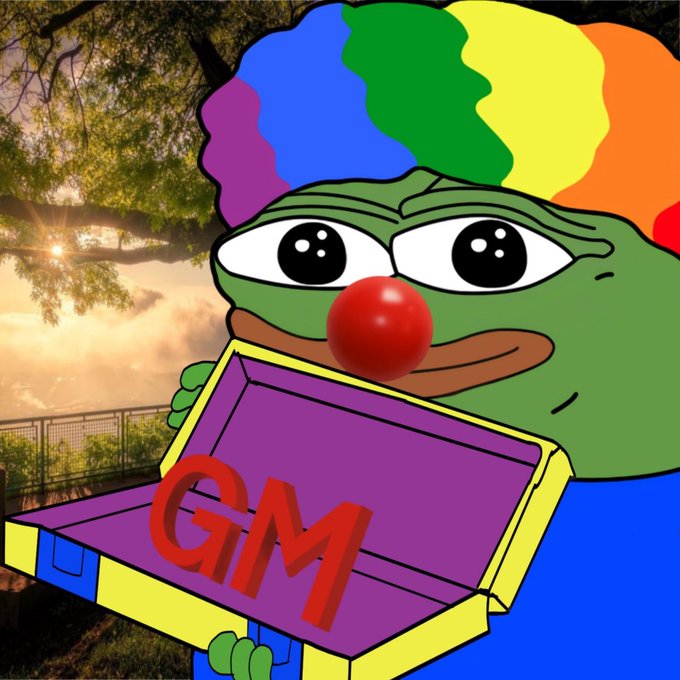 A Pepe the Frog meme character with rainbow-colored hair holding a purple and yellow box labeled 'GM' (good morning) against a sunset background.