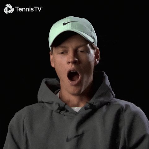 The image shows a man wearing a green Nike sweatshirt with his mouth open, possibly yawning or gasping for breath. The surrounding text suggests that he might be tired, as indicated by the post from the Tennis TV network about trading stocks when feeling exhausted.