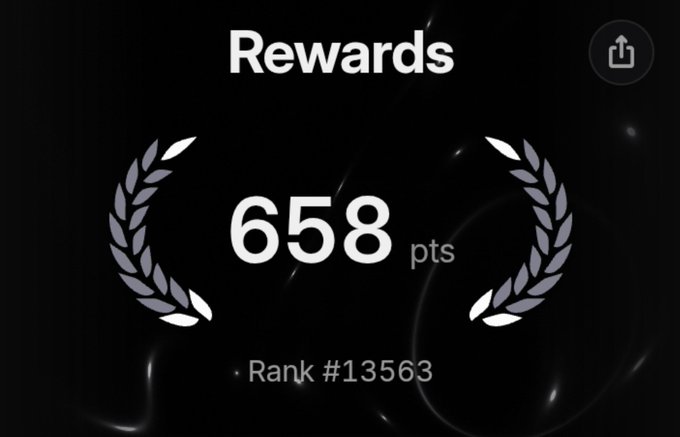 A digital rewards screen displays '658 pts' with a 'Rank #13563' below it, flanked by laurel wreath graphics on a dark background.