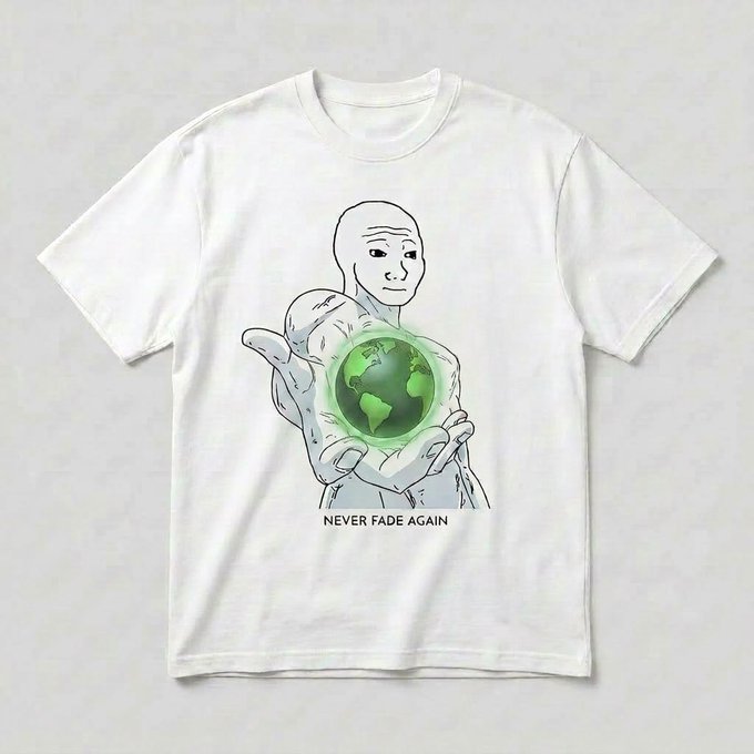 A white t-shirt featuring a line drawing of a Wojak character holding a glowing green Earth, with the text "NEVER FADE AGAIN" printed below, promoting a giveaway of these t-shirts as a reward for the listing of a related token.