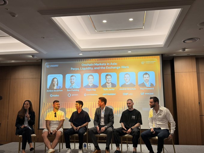 The image shows a panel discussion titled "Onchain Markets in Asia: Perps, Liquidity, and the Exchange Wars" at a Cointelegraph event, featuring moderator Ambre Soubrian alongside panelists from Kaiko, Robin, Chromatic, Optimism, DWF, and Wincent. The context indicates Kyle Jenke (COO) is representing Optimism on this panel, highlighting that leading exchanges are built on the OP Stack.