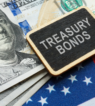 A chalkboard sign reading "TREASURY BONDS" rests atop fanned-out U.S. dollar bills and an American flag, visually underscoring the post's message about historic global government bond yields, including the U.S. 10Y and 30Y reaching multi-decade highs above 5%.