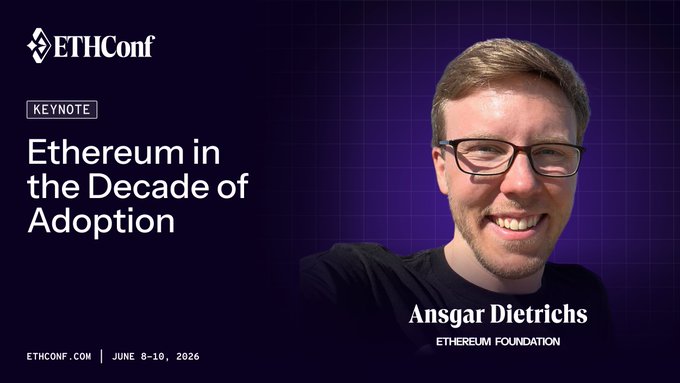The image features a man wearing glasses smiling for the camera while standing against a purple background with white text. The caption of the image reads "Ethereum in the Decade of Adoption" which is related to the main topic of the image, which is about Ethereum and its adoption.