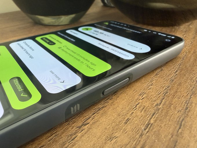 A smartphone on a wooden surface displays a delivery app interface with notifications showing an order in progress for 10 minutes.