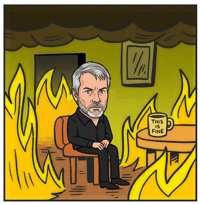 A cartoon depicting a bearded man in black sitting calmly in a burning room with a coffee mug labeled 'THIS IS FINE,' referencing the popular 'This is Fine' meme.