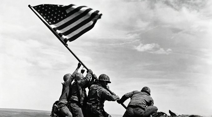 The iconic black-and-white photograph of U.S. Marines raising the American flag on Mount Suribachi during the Battle of Iwo Jima in World War II.