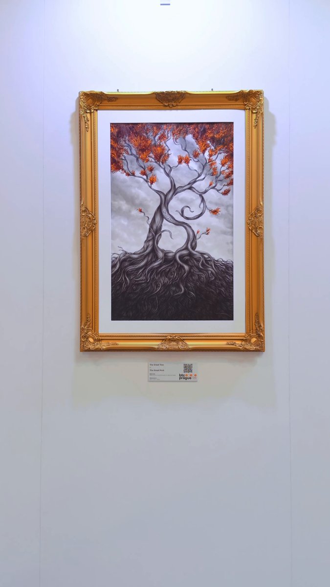 The image features an artwork of two trees, one brown and one red, placed inside a gold frame against a white wall. The painting depicts the roots of the trees intertwined with each other, creating a sense of unity between them. The art gallery has a "Start with Sats Studio" theme, which suggests that this is a space for Bitcoiner artists to showcase their work.