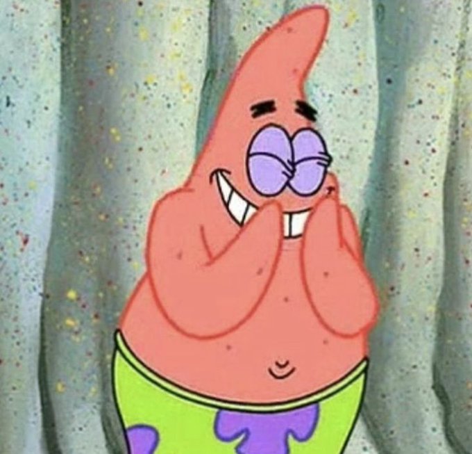 Patrick Star from SpongeBob SquarePants stands with his hands pressed to his cheeks, grinning widely with closed purple eyes.