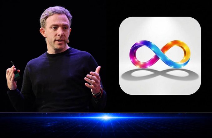 A man in a dark sweater presenting on stage with a large Meta (Facebook) infinity logo displayed on a screen to his right.