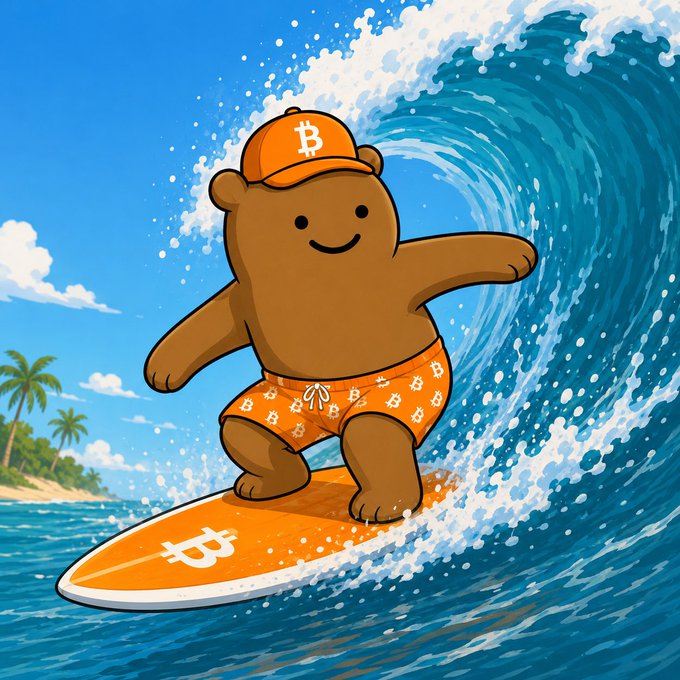 A colorful cartoon illustration of a brown bear wearing an orange Bitcoin cap and swim trunks, surfing a wave on an orange surfboard featuring the Bitcoin logo.
