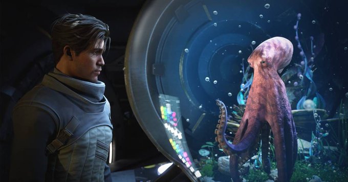 A man in a dark futuristic jacket stares intently at an octopus behind a glass tank containing colorful underwater flora, accompanied by floating bubbles, with a glowing control panel displaying illuminated buttons between them.

The image humorously illustrates the post's bewildered reaction—pairing the absurd sight of a man intently observing an octopus with the equally "absurd" news headline about gaming-focused outlet Polygon publishing an article about Netflix's *Our Flag Means Death* rather than video games.