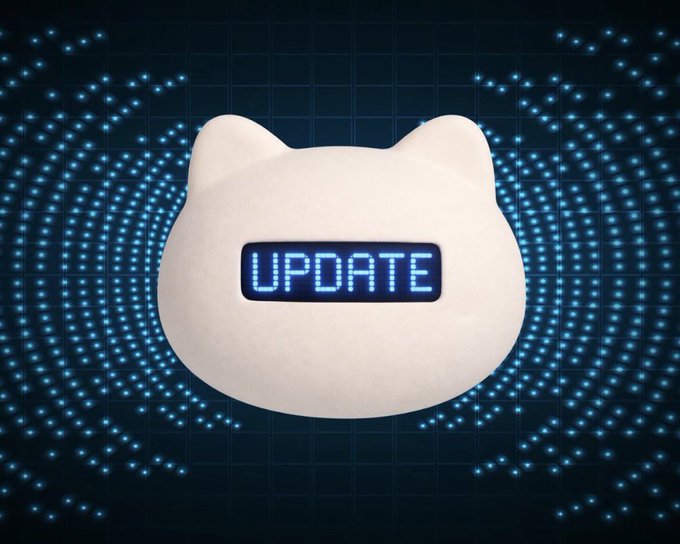 A digital illustration of a white cat-shaped speech bubble displaying the word "UPDATE" in glowing blue pixelated text, set against a dark blue background with radiating light patterns.