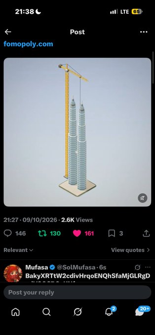 A mobile phone screenshot of a social media post on fomopoly.com showing an isometric 3D render of two skyscrapers under construction, with 2.6K views and a reply from user @SolMufasa containing a crypto-style address.