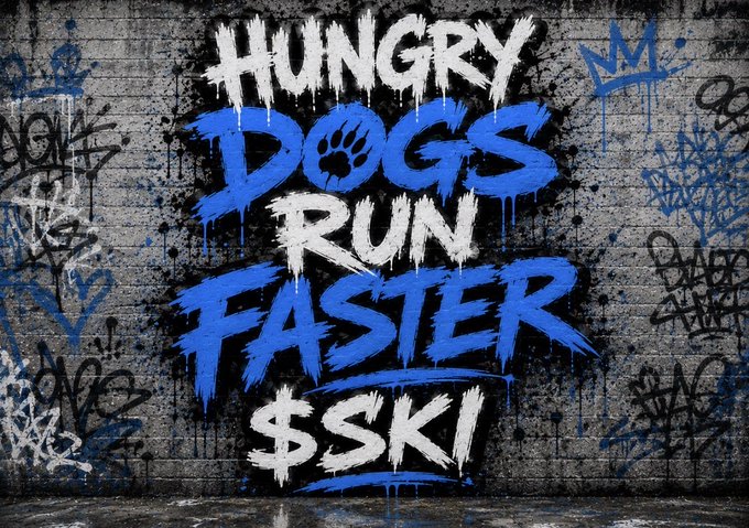 Street art graffiti on a concrete wall reading 'HUNGRY DOGS RUN FASTER $SKI' in white and blue paint, with a paw print in the letter 'O' of 'DOGS'.
