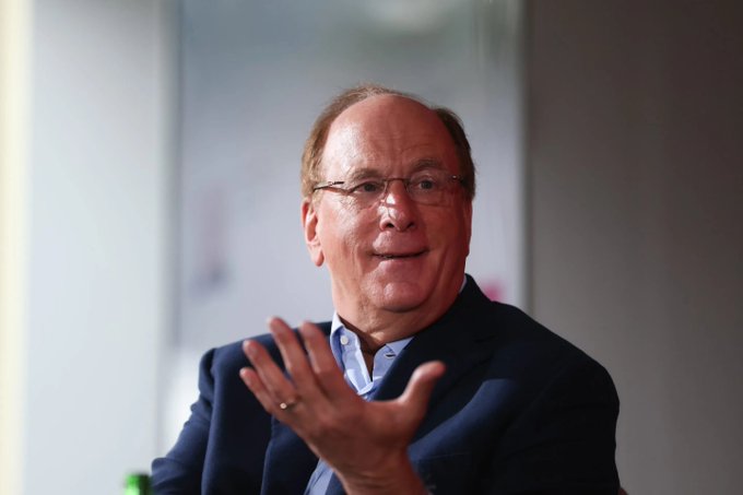 A smiling older man in a dark suit and glasses gestures with his hand while speaking, appearing engaged in a discussion or interview.

*Note: I cannot identify the person in the image based on their appearance. The image itself does not contain any visible text, numbers, logos, or identifying information that ties it to the post about BlackRock's cryptocurrency purchases. If this is intended to depict a specific individual connected to BlackRock or the post's content, that connection isn't visible within the image itself.*