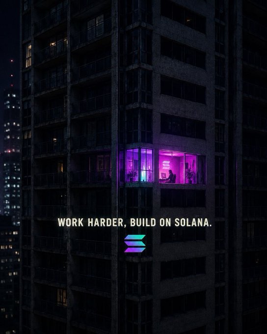 Dark moody image of a high-rise apartment building at night with one window glowing pink and purple, overlaid with text 'WORK HARDER, BUILD ON SOLANA.' and the Solana logo.