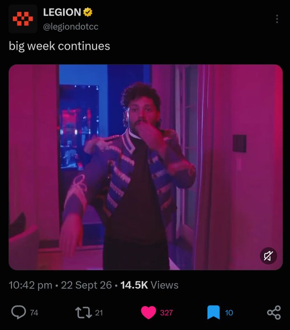 A tweet from @legiondotcc posted at 10:42 pm on 22 Sept 26 with 14.5K views shows a screenshot of a music video with the caption 'big week continues,' featuring a man in a striped jacket dancing in a room lit with pink and blue lights.