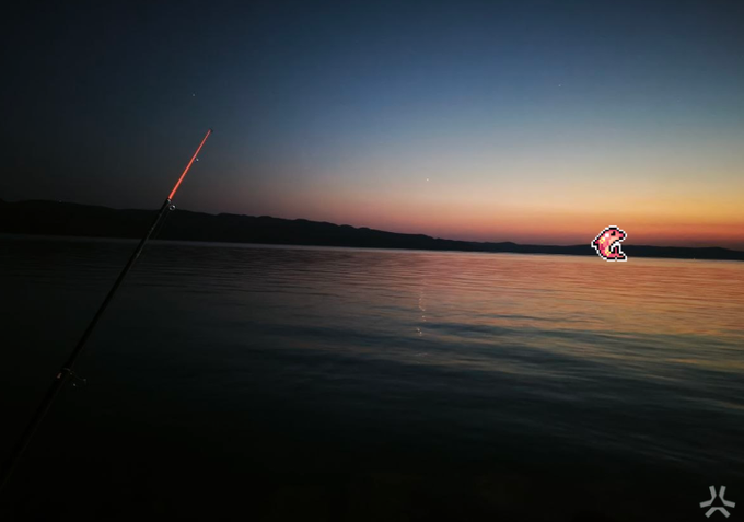 A fishing rod tip with a glowing orange indicator extends over a calm lake at twilight, with mountains silhouetted on the horizon and a fish-shaped icon overlay on the right.