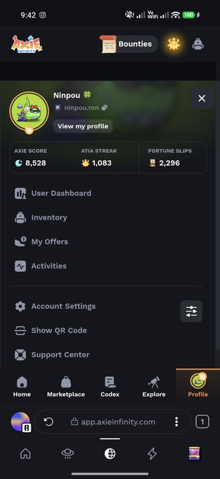 A mobile screenshot of the Axie Infinity app showing a user profile for 'Ninpou' with an Axie Score of 8,528, an Atia Streak of 1,083, and 2,296 Fortune Slips.