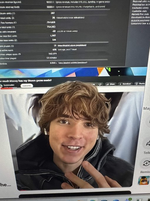A computer monitor displays a webpage with statistics showing "$FRAG" token details including a 22.78% gain and 154,063 sales, while a YouTube video plays below featuring a young man with curly hair in a black leather jacket making a peace sign, with the video title partially reading "much money has my Steam game made?" The image relates to the post by showing what appears to be the alleged developer behind the $FRAG Solana rugpull, with users reportedly putting bounties to identify him, though the visible stats show gains rather than the ~$200,000 extraction mentioned.
