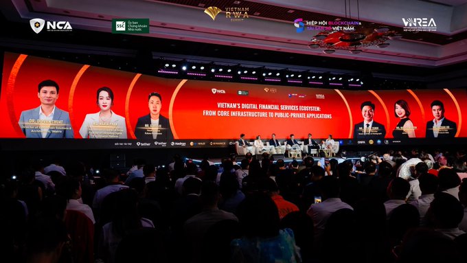 Conference hall with a large screen displaying 'Vietnam's Digital Financial Services Ecosystem: From Core Infrastructure to Public-Private Applications' at the Vietnam RWA Forum, with a panel and audience in attendance.