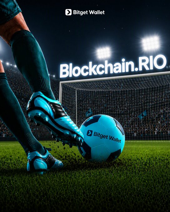 A soccer player in teal cleats strikes a "Bitget Wallet"-branded ball on a stadium pitch beneath bright floodlights, with the text "Blockchain.RIO" and the Bitget Wallet logo prominently displayed. The image ties into the post's playful "goals = swag" challenge by linking cryptocurrency branding with the excitement of scoring goals as Bitget Wallet announces its presence in Rio de Janeiro.