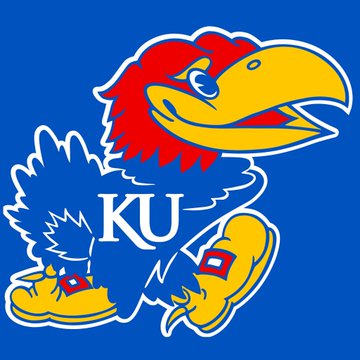 The image shows the University of Kansas Jayhawks mascot, a blue and red bird with "KU" lettering on its chest, set against a blue background. This relates to the news about Ripple's sponsorship deal with the Kansas Jayhawks, making it the first cryptocurrency featured on a major college program's jerseys.