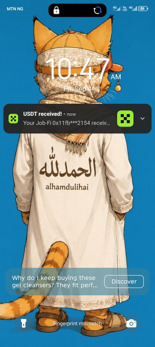 An anime-style phone wallpaper showing a cat-girl character in an Arabic thobe with "alhamdulillah" printed on it, displaying the time 10:47 AM and a USDT received notification from Job-Fi.