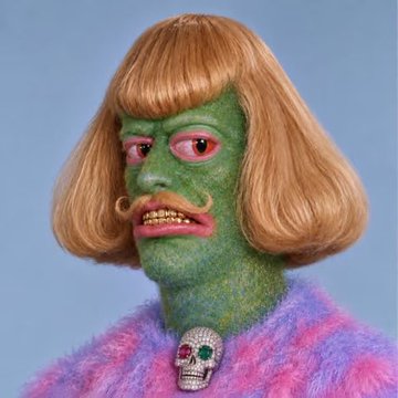 Surreal portrait of a figure with green skin, a blonde bob haircut, a curled mustache, and a pink and blue fuzzy sweater with a skull brooch.