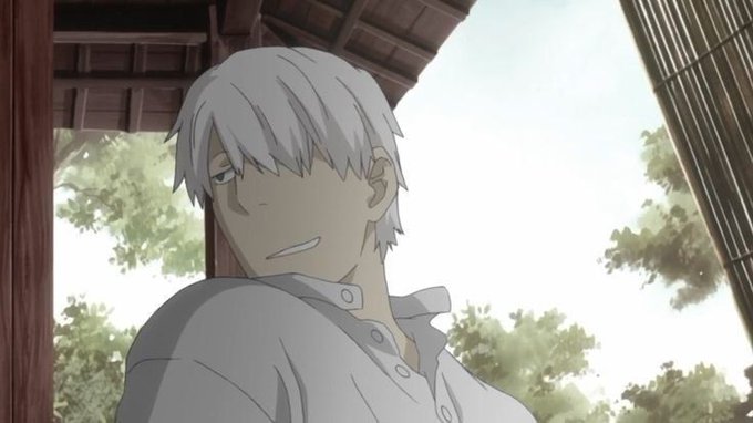 An anime scene features a white-haired young man with a serious expression wearing a light gray shirt, standing under a wooden structure with trees in the background.