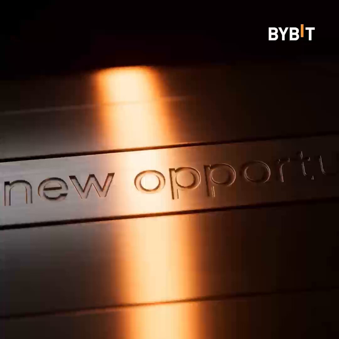The image features a close-up of a metal sign with the words "New Opportunity" written on it, which appears to be made of steel or brass. The background of the photo is dark, making the sign stand out prominently. The text "SpaceX", "AI", and " cryptocurrency" are also present in the image, suggesting that this could be related to a business or technology-related topic.