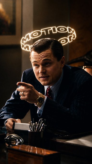 Leonardo DiCaprio as Jordan Belfort from The Wolf of Wall Street sits at a desk with a 'Motion Motion' halo added above his head.