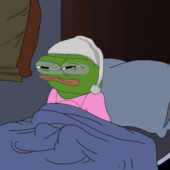 An animated image of Pepe the Frog wearing a white nightcap and pink pajamas, lying in bed under blue covers with a tired expression, from the show Smiling Friends.