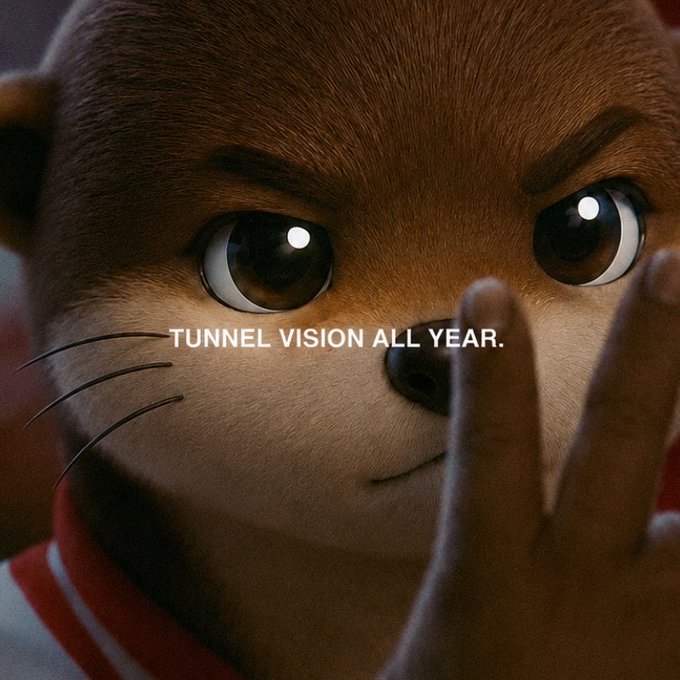 A close-up of an animated cat character with large eyes holding up fingers, with the white text 'TUNNEL VISION ALL YEAR.' overlaid across the image.