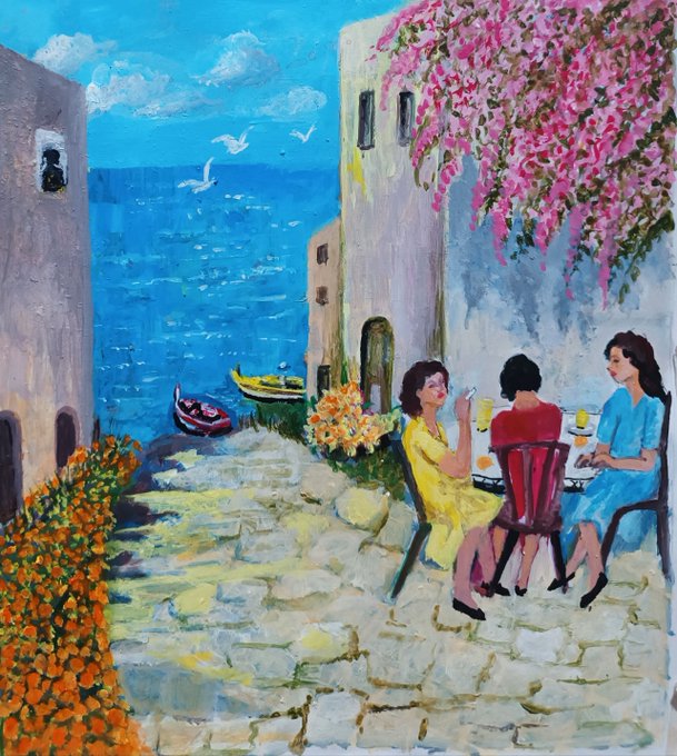 An impressionist-style painting depicting three women sitting at a cafe table on a cobblestone street overlooking the sea, with bright pink flowers cascading from a building above.