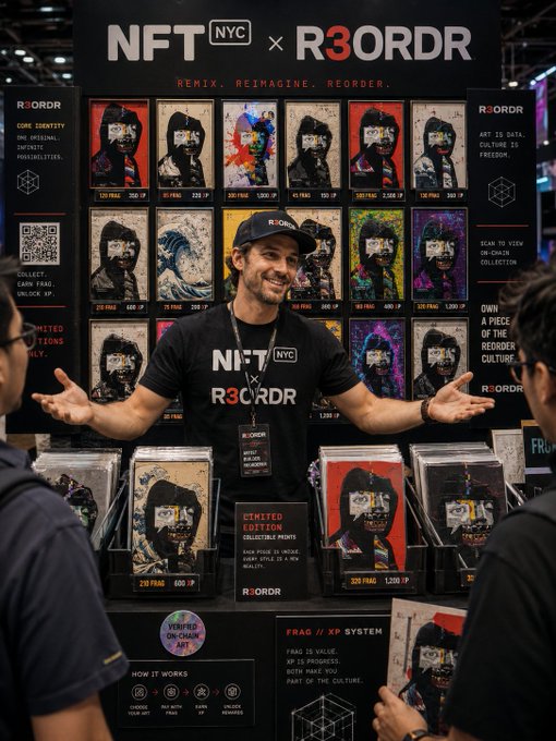 At the NFT NYC event, a representative for R3ORDR stands proudly in front of his booth, showcasing a collection of "Frag" NFT artworks with prices listed in IP (e.g., 220 FRAG 600 IP) and the slogan "REMIX. REIMAGINE. REORDER." visible above the display.