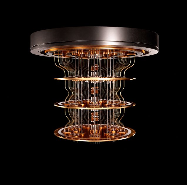 A cylindrical, multi-tiered quantum computer or cryostat with gold-colored circuitry and components suspended inside, set against a black background.