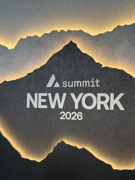 A promotional poster for "Summit New York 2026" featuring a dark mountain silhouette with the Summit logo against a warm glowing background.