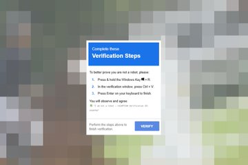 A pop-up window on a blurred webpage background displays Coinbase's 'Verification Steps' with instructions to hold the Windows key, press Ctrl + V, and press Enter on the keyboard to paste verification, followed by a green checkmark indicating success.
