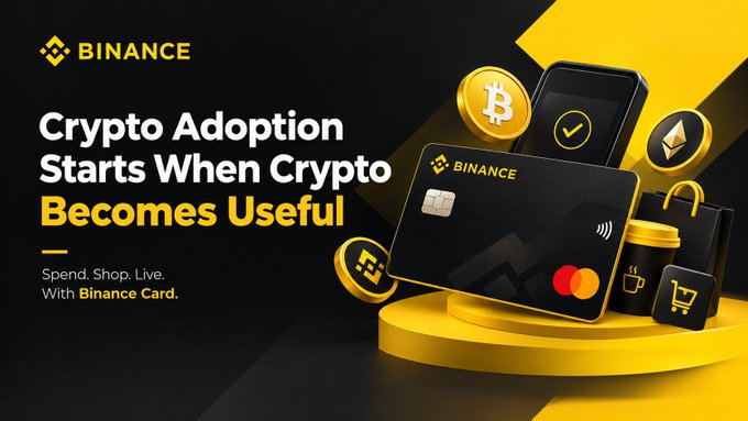 A Binance promotional banner reads "Crypto Adoption Starts When Crypto Becomes Useful" with the tagline "Spend. Shop. Live. With Binance Card," featuring a black and yellow credit card alongside Bitcoin and Ethereum coins and shopping bags, directly illustrating the message about using crypto for everyday purchases.