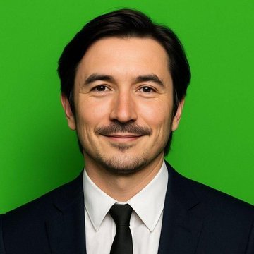 A professional headshot of a man with dark hair and a goatee, wearing a dark suit, white shirt, and black tie, photographed against a bright green screen background. The neutral portrait likely serves as a stand-in or representative image accompanying the post about Robinhood's CEO discussing asset tokenization.
