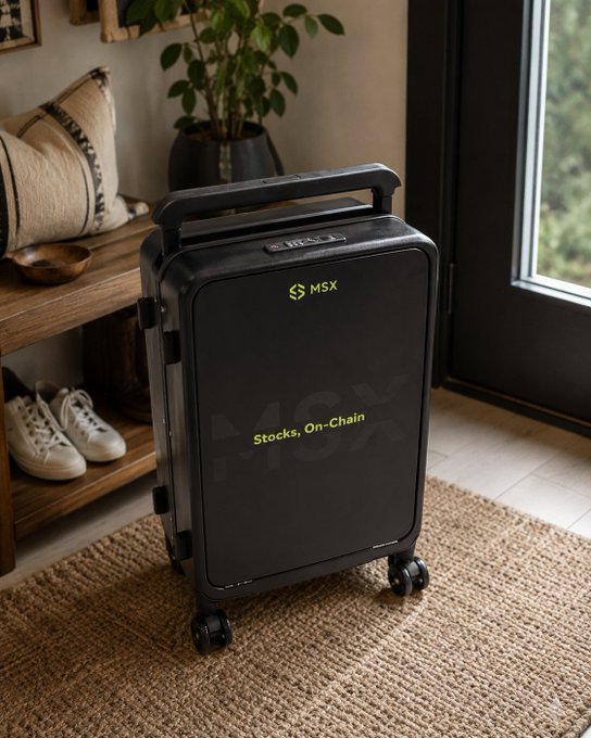 A black suitcase labeled "MSX" with the text "Stocks, On-Chain" sits in a home entryway next to a shoe rack and potted plant, representing the travel gear prize in MSX's giveaway promotion with Maitong.