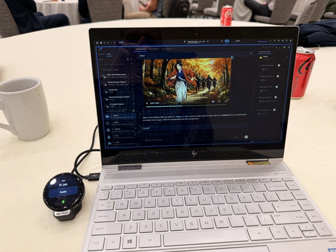 An HP Spectre laptop sits on a white table displaying a video about "How to Open...", accompanied by a Galaxy Watch 4 Classic charging on a Samsung puck and a white coffee mug.
